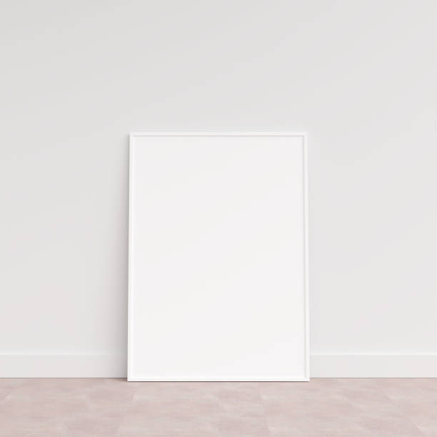 istock Empty picture frame on wooden floor leaning against wall. Blank poster frame standing on wooden floor. Blank poster frame mockup. Empty picture frame mockup. 3d rendering. 1665955365