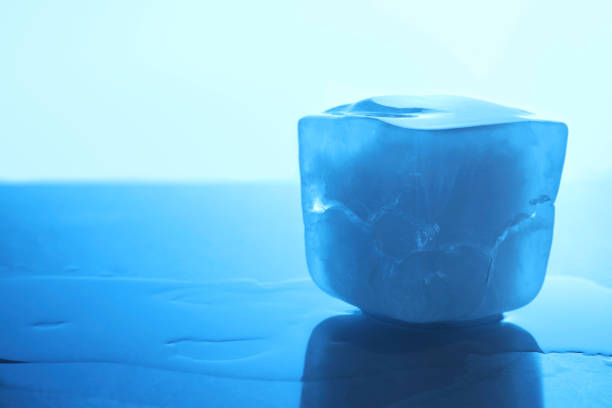 istock One crystal clear ice cube on light blue background, closeup and space for text. Color tone effect 1665955957