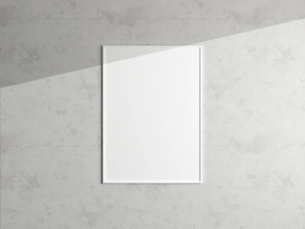 istock Minimal poster picture frame mockup hanging on the white wall. Blank frame mockup. Clean, modern, minimal frame. 3d rendering. 1665956485