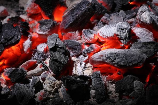 istock Pieces of hot smoldering coal as background, closeup 1665968259