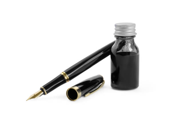 istock Stylish black fountain pen and inkwell isolated on white 1665969430