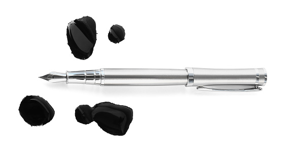 Stylish silver fountain pen and blots of ink isolated on white, top view