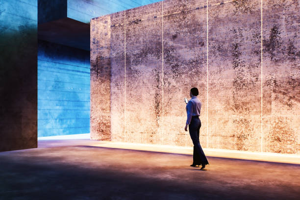 istock Woman walking in futuristic concrete environment 1665981520