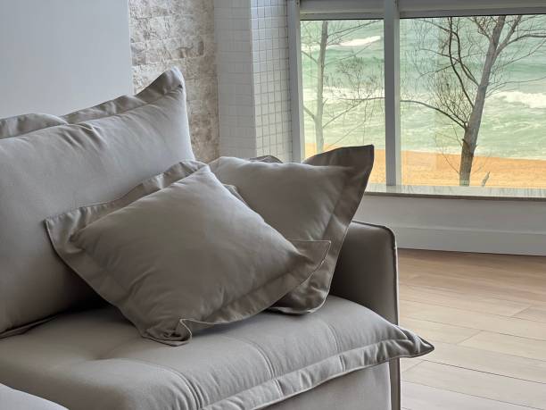 istock Neutral living room facing the sea 1665984236