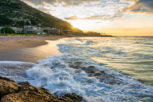 Beach landscape in Haifa, Israel during a dramatic sunset.