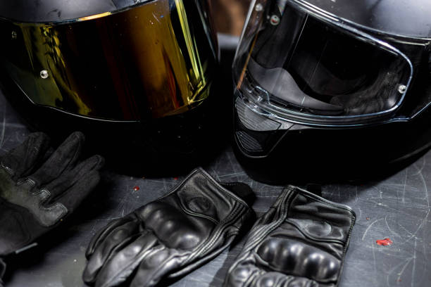 istock motorcycle equipment, leather helmets and gloves. 1666002654