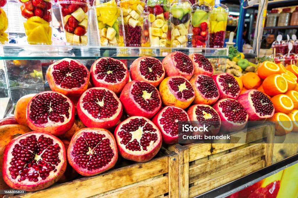 Juice Bar Carmel Market Tel Aviv Israel Fruits are displayed at a fruit juice stand at Carmel Market in Tel Aviv, Israel. Pomegranate Stock Photo