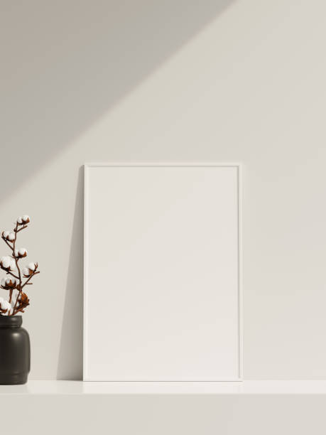 istock Empty poster frame mockup in sunlight with shadow and vase 1666013540