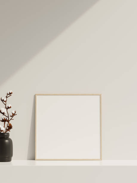 istock Empty poster frame mockup in sunlight with shadow and vase 1666013554