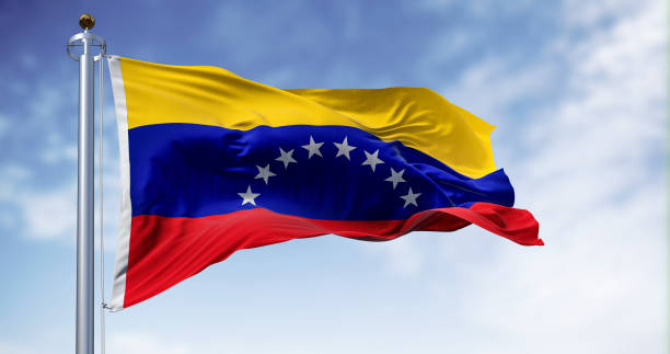 venezuela national flag waving in the wind on a clear day - venezuelan flag imagens e fotografias de stock