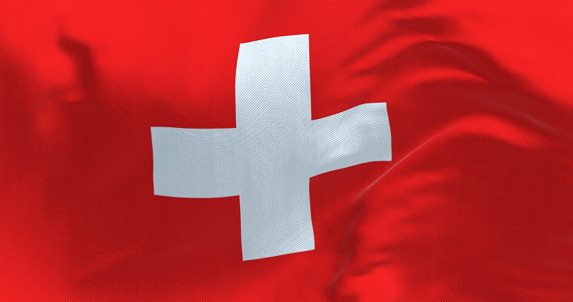 Close-up view of Switzerland national flag waving in the wind. Red background with a white cross in the center. 3d illustration render. Fluttering fabric background