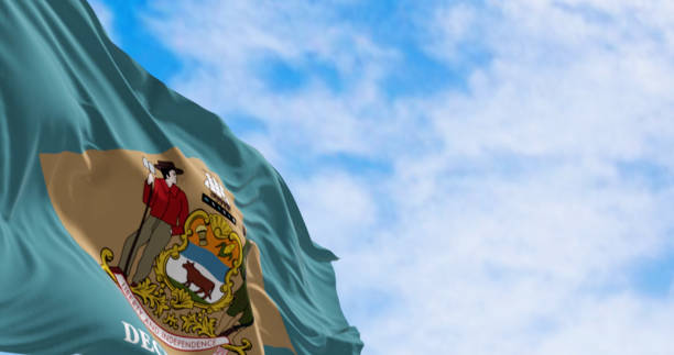 istock Delaware state flag waving on a clear day 1666017387