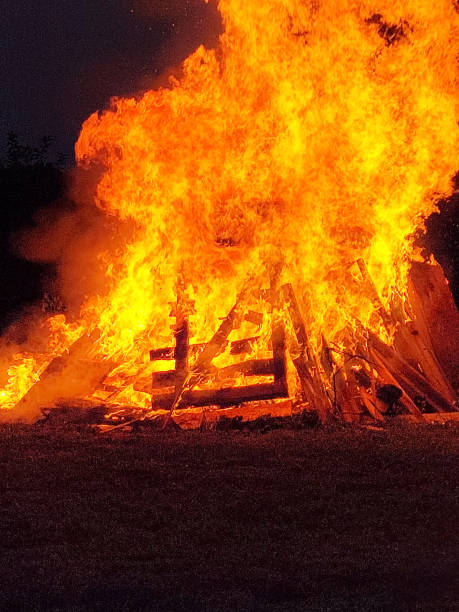 istock Huge Bonfire in the country at dusk 1666023391