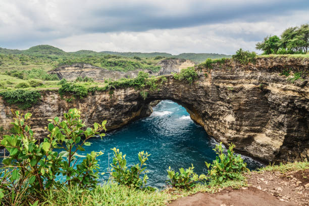 istock Stone arch over the sea. 1666024467