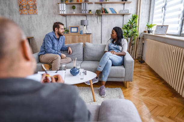 istock Married couple talking with marriage counselor about their relationship 1666054212