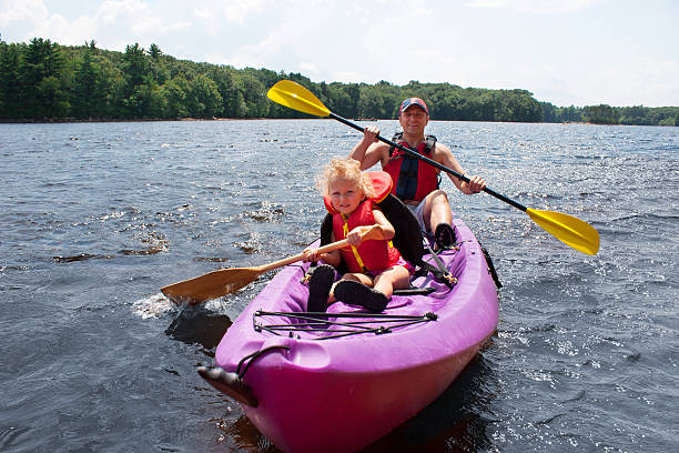 istock Father and daughter kayaking 166605465
