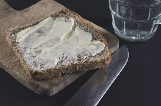 istock Wholemeal bread, water and old knife 1666071736
