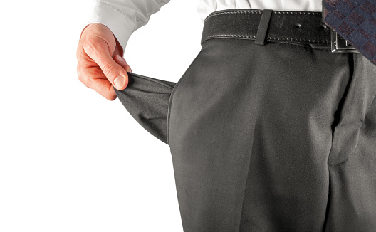 Bankruptcy concept. Bankrupt business man showing empty pocket with hand isolated on white background