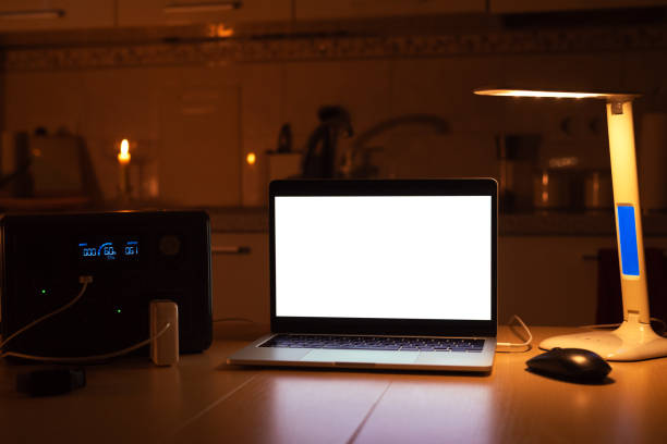 istock Charging station for laptop and desk lamp when there is no light during blackout. Generator power bank battery in the absence of electricity. at home table 1666104463