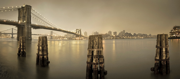 Panorama of Brooklyn Bridge in sepia.