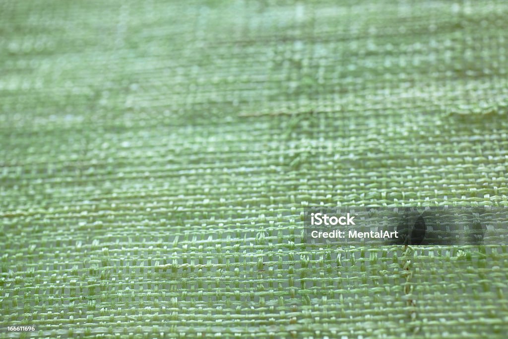 Green Weave Background Green woven background, soft focus areas good for copy. Backgrounds Stock Photo