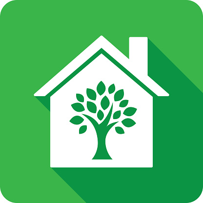 Vector illustration of a house with tree icon against a green background in flat style.
