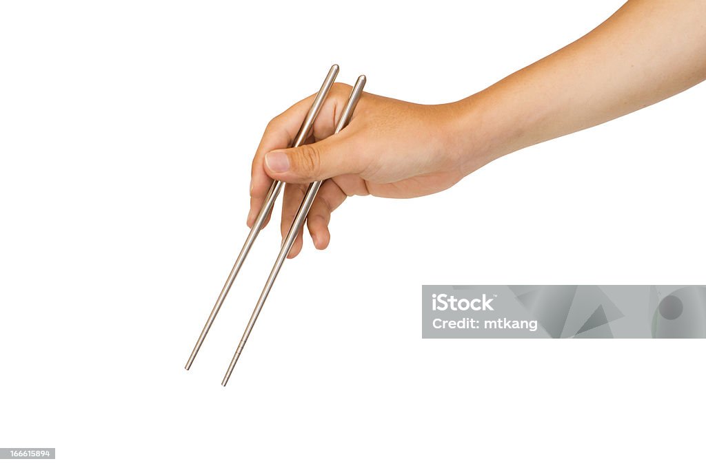Mano agarrando chopstick aislado - Foto de stock de Cultura coreana libre de derechos
