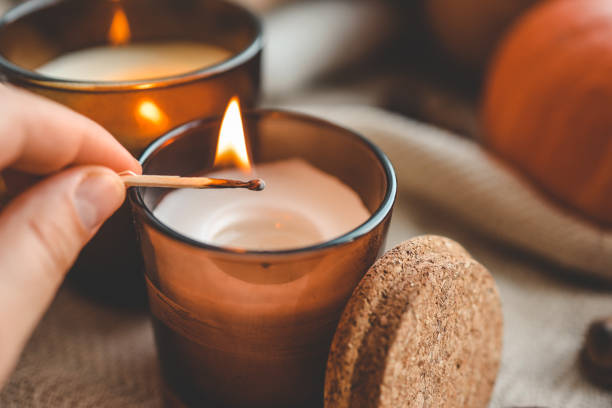 istock Match in hand lights a candle, cosiness concept 1666164067