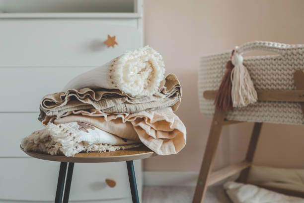 istock Stack of baby muslin blankets and newborn diapers 1666168898