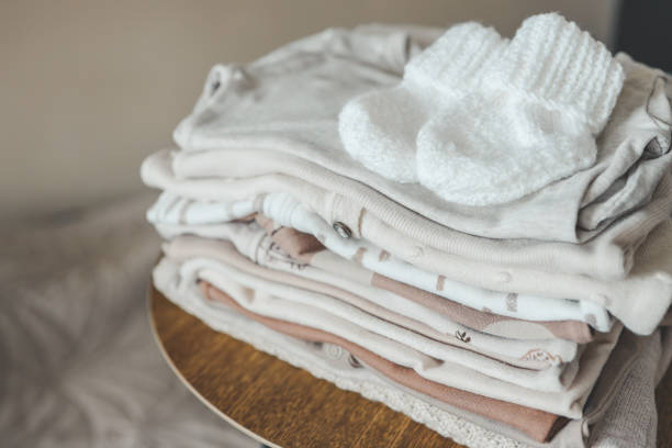istock A stack of baby clothes and knitted socks for a baby 1666173213
