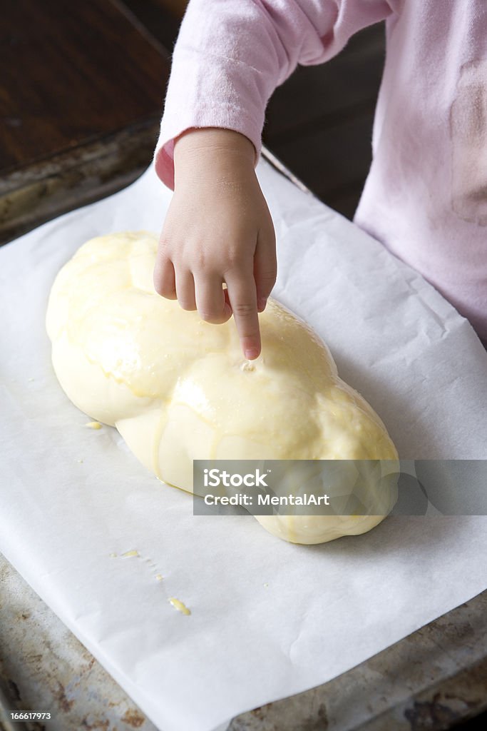 Bread Dough Little girl's finger sticking into bread dough. Assistance Stock Photo