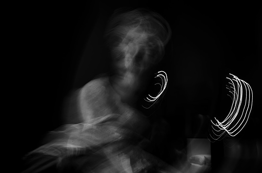 Bust of an ancient Greek god from the period of antiquity. Motion blur in black and white