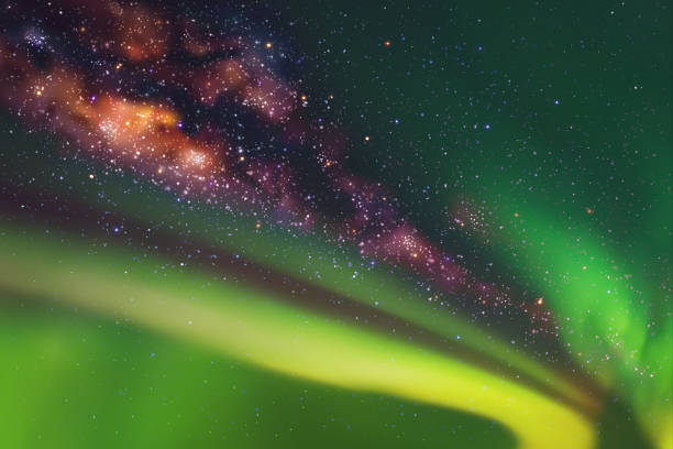 Green aurora borealis Night starry sky. Milky Way and Northern lights aurora borealis orange stock illustrations