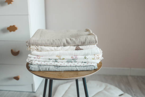 istock Stack of baby muslin blankets and newborn diapers 1666191447