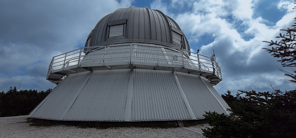 A night sky full of stars and an observatory on Ishigaki island.