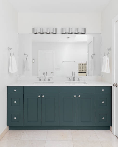 istock A bathroom with a blue green vanity cabinet. 1666203419