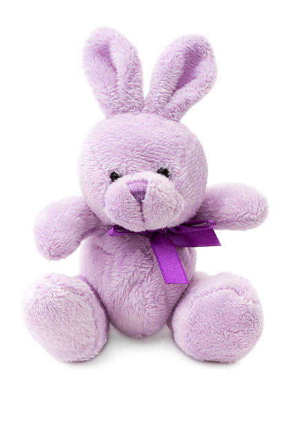 toys: small pink or lilac rabbit, isolated on white background - speelgoedbeest stockfoto's en -beelden