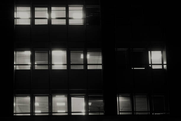 istock office building facade windows with venetian blinds at night 1666214876