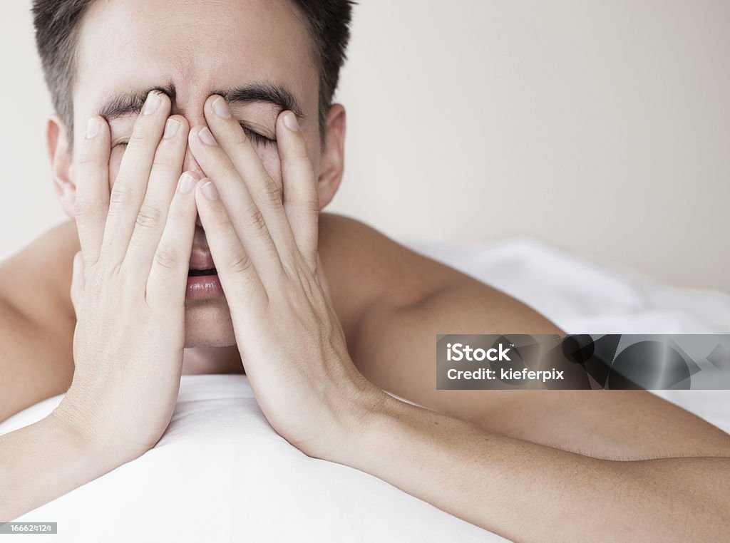 Exhausted and tired Male with lack of sleep. Sleep Apnea Stock Photo