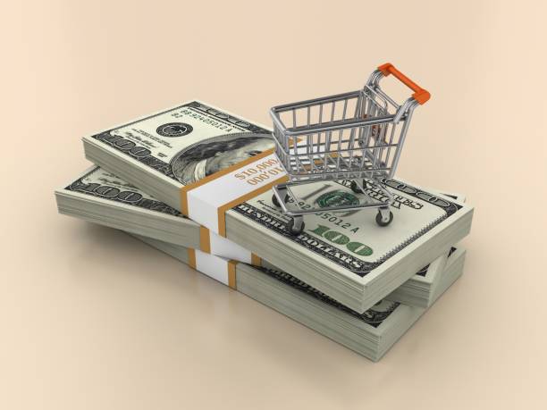 стопка долларовых купюр с корзиной - three dimensional shape paper currency wealth shopping cart стоковые фото и изображения