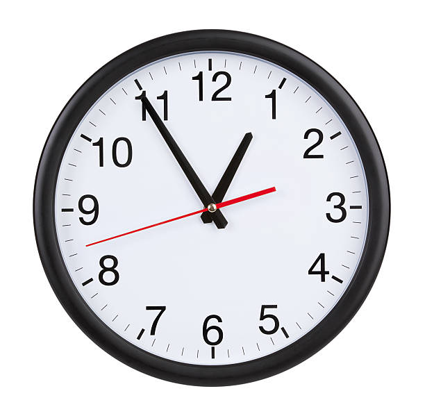 istock Office clock shows five minutes to an hour 166629672