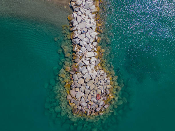 istock Breakwater on the sea coast for protection from waves. Italy 1666296843