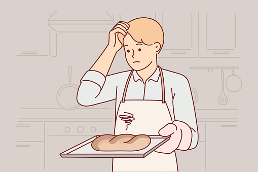 Confused baker holds tray with spoiled bread, burnt due to non-compliance with cooking technology, stands in kitchen. Sad clumsy baker needs refresher course or professional education