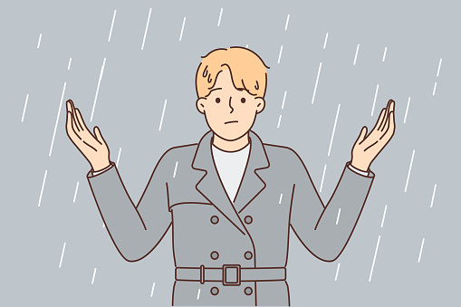 Man stands under rain and spreads arms, stressed due to lack of umbrella and roof over head. Rain is metaphor for problems for businessman suffering from bad environment and beginning of crisis.