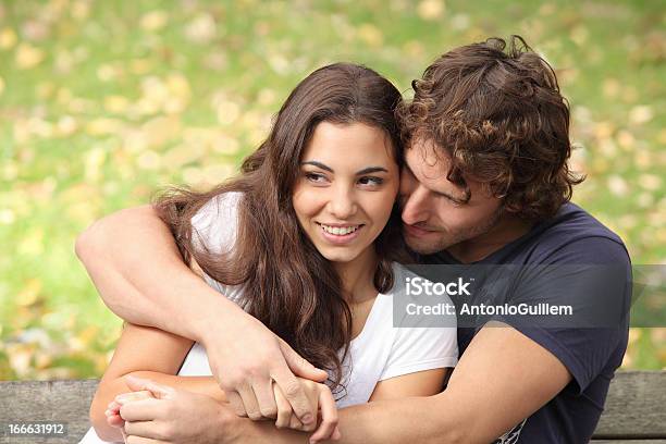 Couple Hugging In A Park Stock Photo - Download Image Now - Adult, Adults Only, Beautiful People