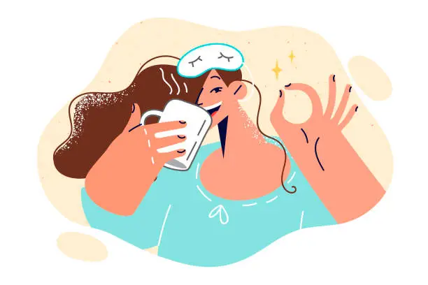 Vector illustration of Cheerful woman in sleep mask drinks coffee and shows OK gesture, rejoicing at start new working day