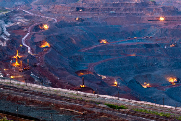 istock Ore mining in the quarry at night 166633070