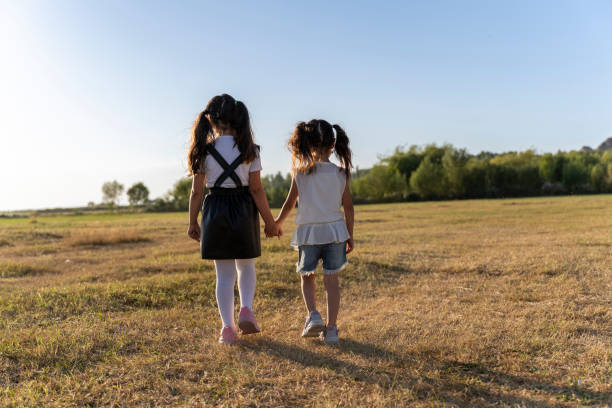 Children having fun in nature. Children having fun in the countryside. Children running in the grass during summer vacation.