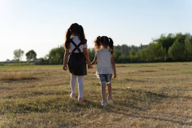 Children having fun in nature. Children having fun in the countryside. Children running in the grass during summer vacation.