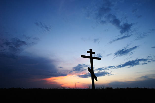 istock cross silhouette with the sunset 166637053